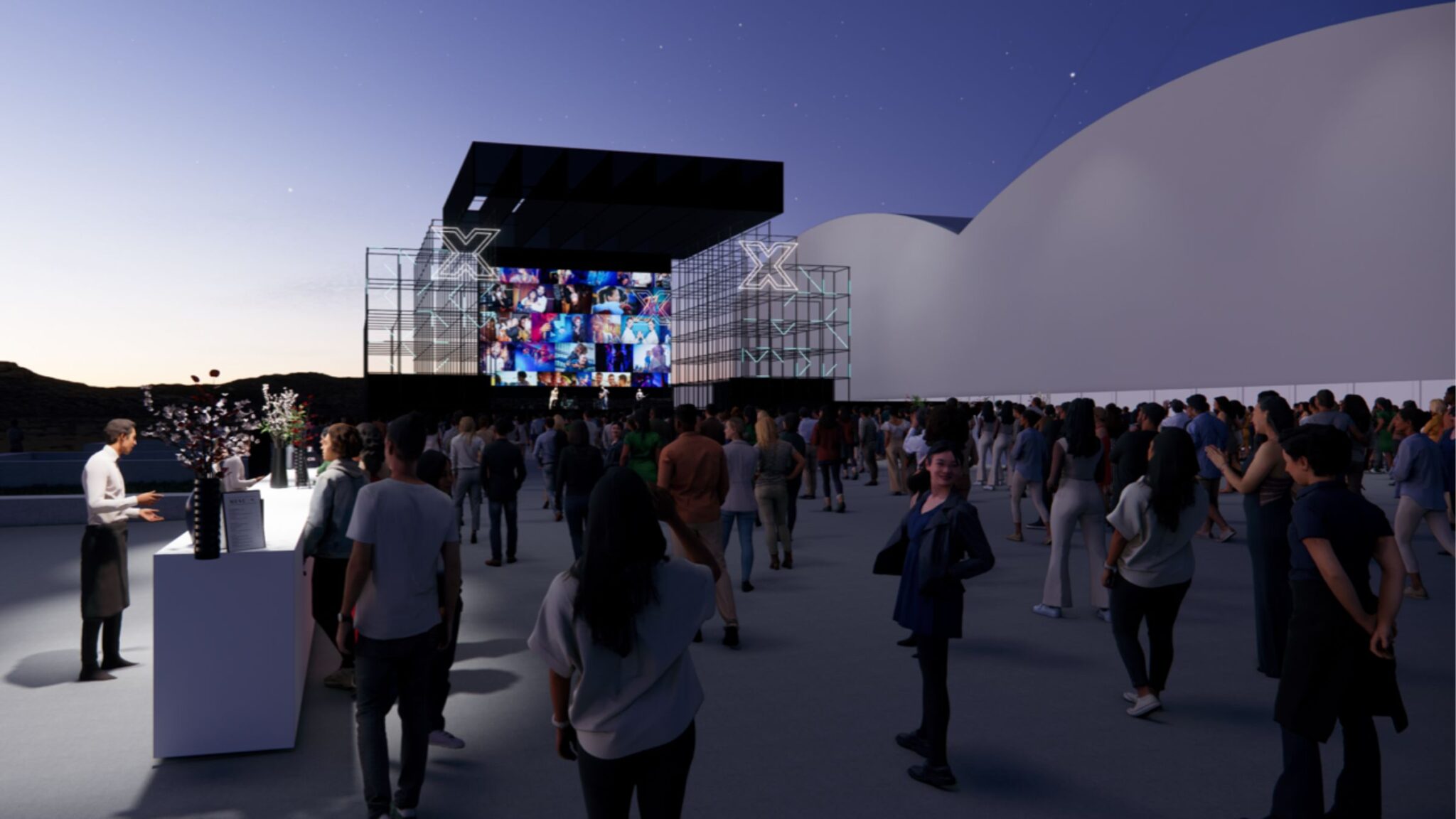 A crowd gathers in front of a large stage displaying a collage of images on a screen, with people standing near a bar area under the evening sky. Battle Royal Studios