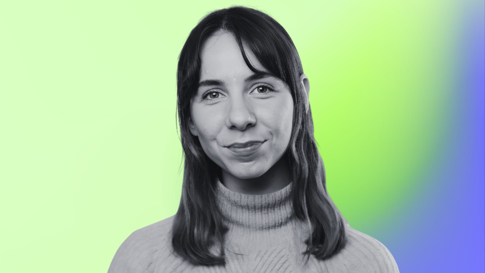 Black and white portrait of a smiling young woman on a green and blue gradient